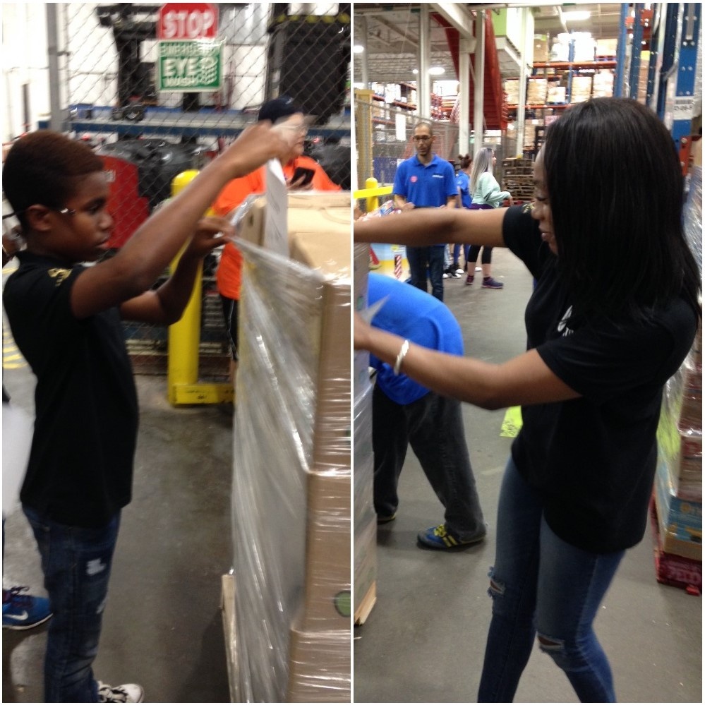 Employee and son in black shirts labeling pallets